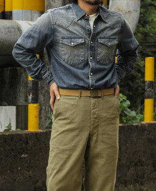 Men's denim western shirt worn with khaki pants, button-front and chest pockets