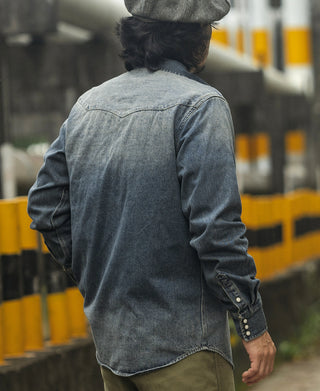 Back view of denim western shirt with western yoke and button detail