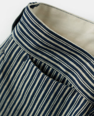 Striped work trousers with blue and off-white pinstripes, curved waistband edge.