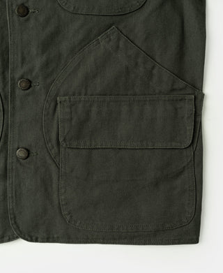 Olive jacket lower front with large patch pocket and snap-button placket