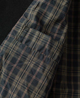 Black duck canvas Cossack jacket with plaid lined cuff and accordion pleats