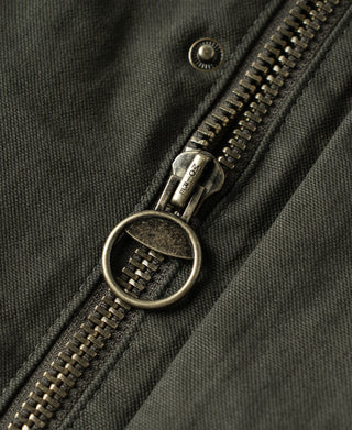 Olive canvas field jacket with metal zipper and large ring pull detail