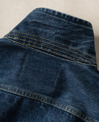 Indigo denim jacket shoulder yoke with layered yellow topstitching
