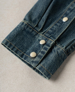 Denim shirt cuff with button placket and contrast stitch detailing