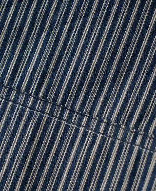Blue-and-white striped jacket fabric with stitched side panel detail
