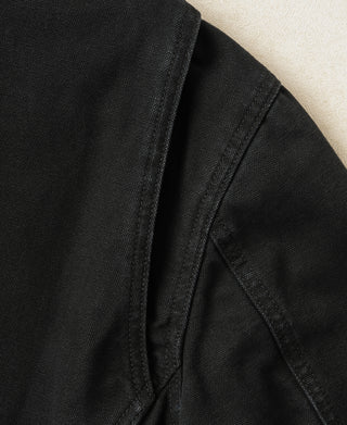 Black jacket interior with structured seam and angled pocket lining