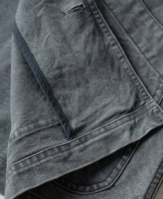 Gray-blue canvas jacket sleeve with buttonhole and stitched cuff