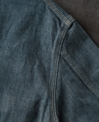Blue denim barn jacket back yoke seam with contrast topstitching