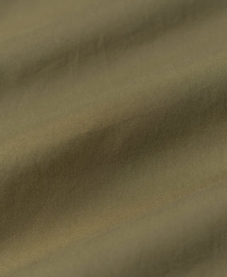 Khaki harrington jacket fabric close-up with fine textured weave