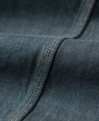 Denim jacket hem seam with reinforced stitching