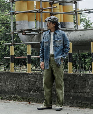 Olive fatigue trousers with straight legs, button waist closure, and belt loops