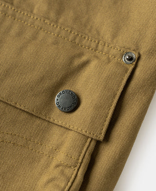 Khaki canvas jacket flap with snap button and metal button