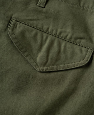 Olive cargo trouser pocket with reinforced stitching