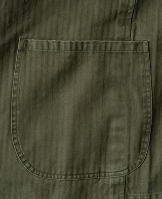 Olive blazer front patch pocket with rounded shape and edge stitching