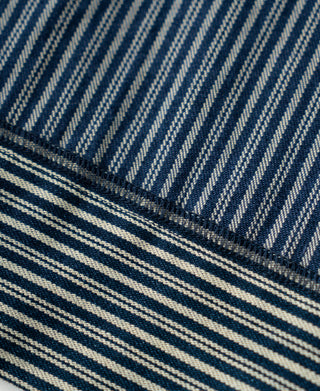 Cuff and stitched hem detail on blue-and-white striped jacket