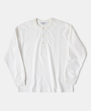 A white long-sleeve henley shirt with a three-button placket.