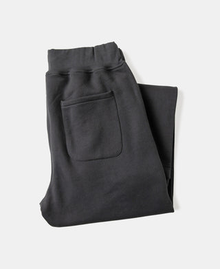 Black heavyweight terry sweatpants with front pocket and elastic cuffs