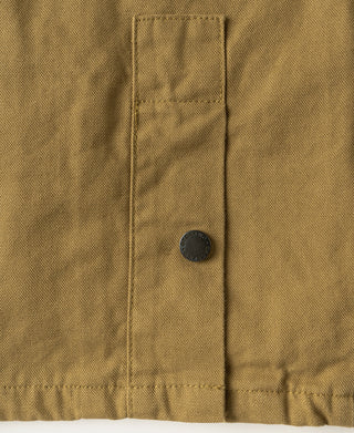 Khaki canvas jacket pocket flap with metal snap and stitched edge