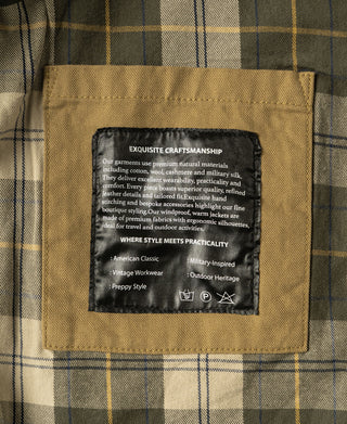 Plaid-lined interior with stitched label patch on khaki field jacket