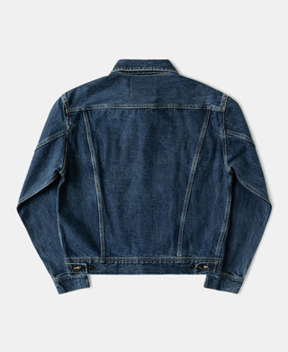 Indigo denim jacket back view with yoke seam and button closure at hem