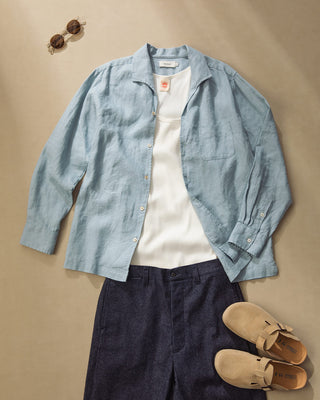Light blue linen long-sleeve shirt with spread collar, button front, and chest pocket