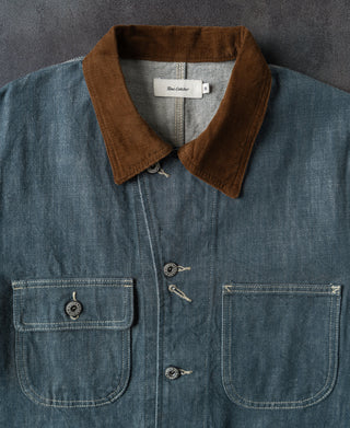 Blue denim barn jacket with brown corduroy-style collar and four front pockets