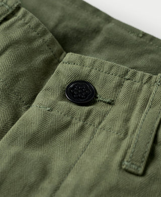 Olive fatigue trousers front yoke with button closure and belt loop