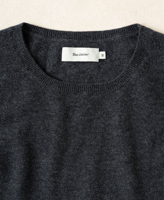 Heather gray merino wool crewneck sweater with ribbed neckline and brand size tag