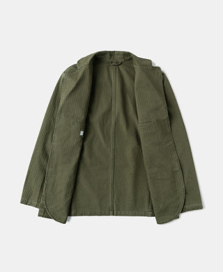 Olive herringbone blazer viewed from inside, showing lining and hidden button placket