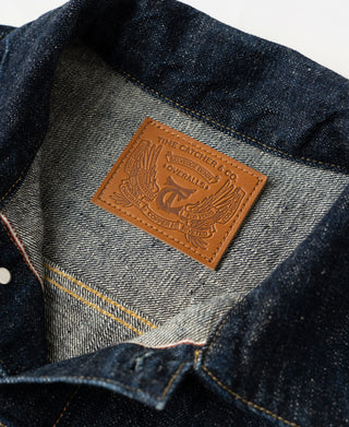 Indigo denim jacket interior label on striped lining near the collar seam