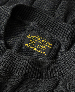 Interior size tag and ribbed knit collar on dark gray sweater