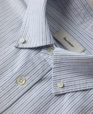 Button-down collar with striped fabric and two cream-tone buttons