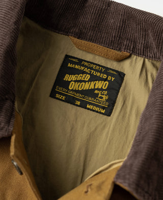 Khaki canvas jacket interior label with dark collar seam