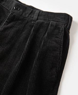 Black corduroy trouser front with belt loops and zip fly