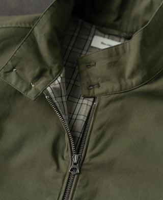 Olive Harrington jacket inside lining detail with front zipper and checked collar