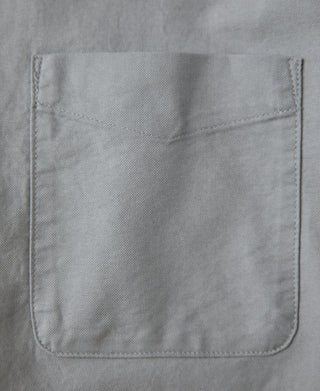 Gray oxford button-down shirt pocket with stitched hem and bartack detail