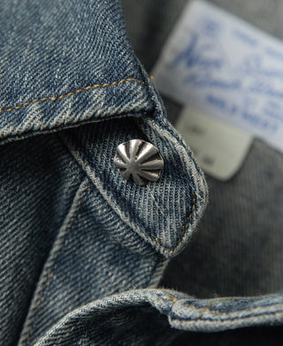 Denim western shirt snap at shoulder seam with engraved metal button