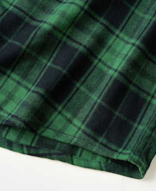 Green plaid shirt hem with double stitching and taped edge