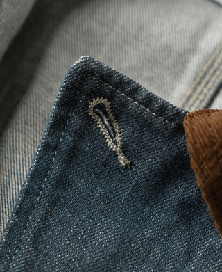 Denim cuff seam with embroidered detail near the jacket placket