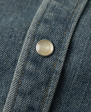 Denim western shirt button close-up on flap or placket