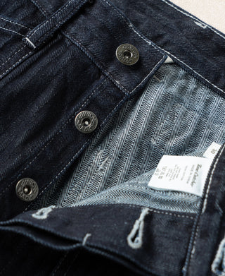 Indigo denim pants interior label and herringbone lining at front waistband