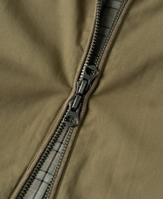 Khaki harrington jacket zipper close-up with double pull and textured teeth