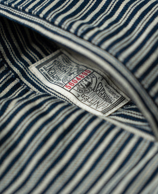 Blue-and-white striped trouser size label near waistband