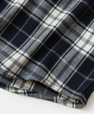 Blue check work shirt hem with curved bottom and visible stitch edging