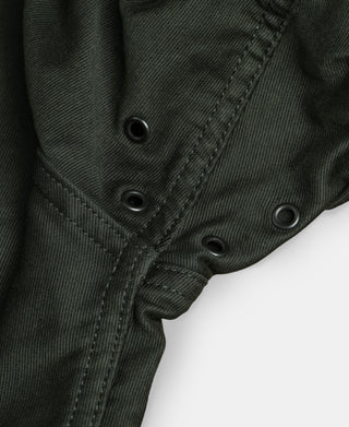 Black olive N-1 deck jacket sleeve cuff and snap button placket close-up