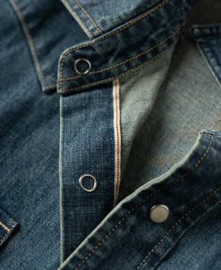 Denim shirt front placket with metal ring snaps and top-stitching