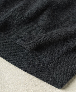Heather gray merino wool sweater sleeve cuff, ribbed knit texture close-up