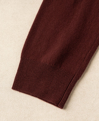 Maroon knit sweater sleeve cuff and ribbed hem