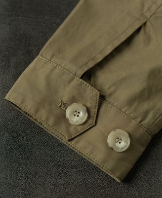 Khaki Harrington jacket cuff with buttoned placket and stitched pocket tab