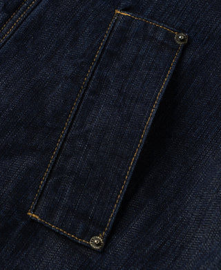 Indigo denim jacket with angled flap pocket and button closure